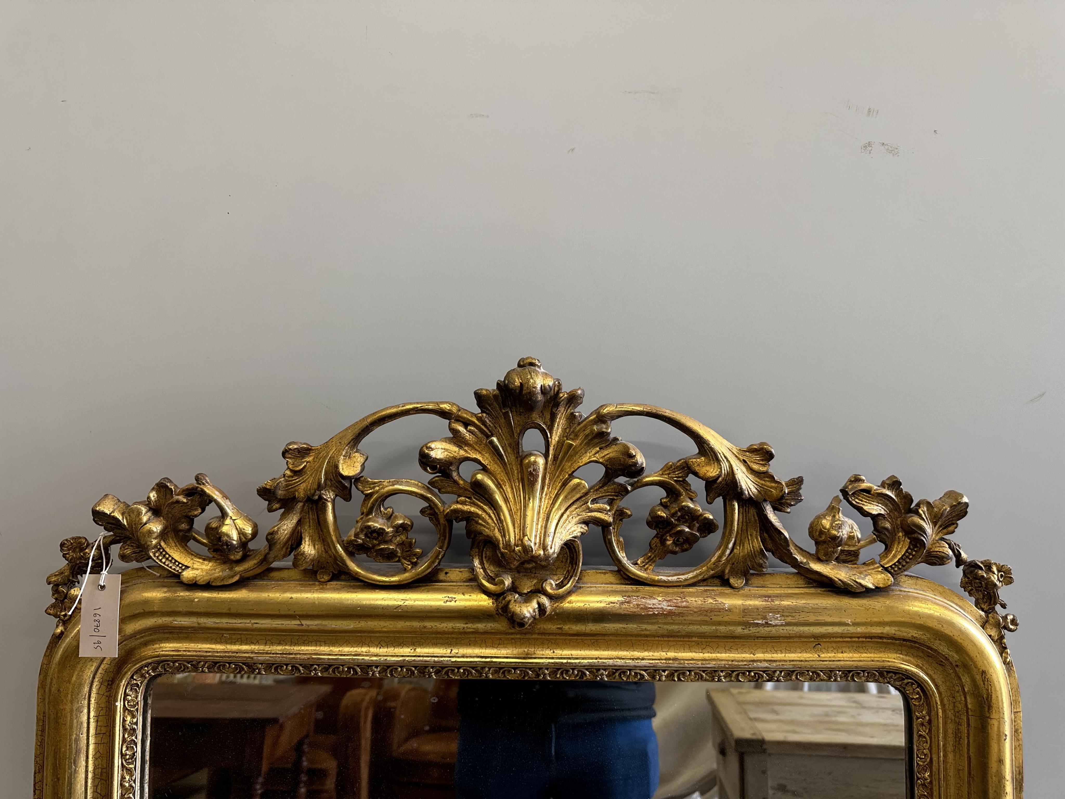 A 19th century French giltwood and composition overmantel mirror, width 88cm, height 140cm. Condition - fair to good